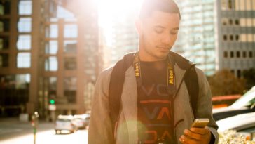 Millenial-holding-mobile-phone